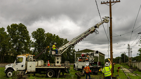 Linemen are hard at work at the Ohio Railway Museum, installing new poles for the future double track through the old Silcott Yard.
